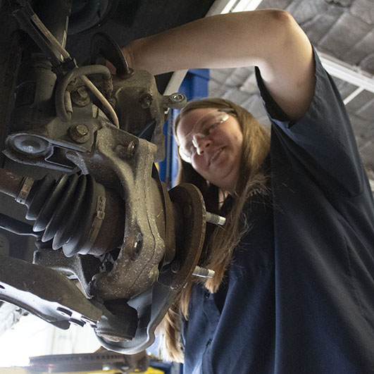 automotive student working on a car